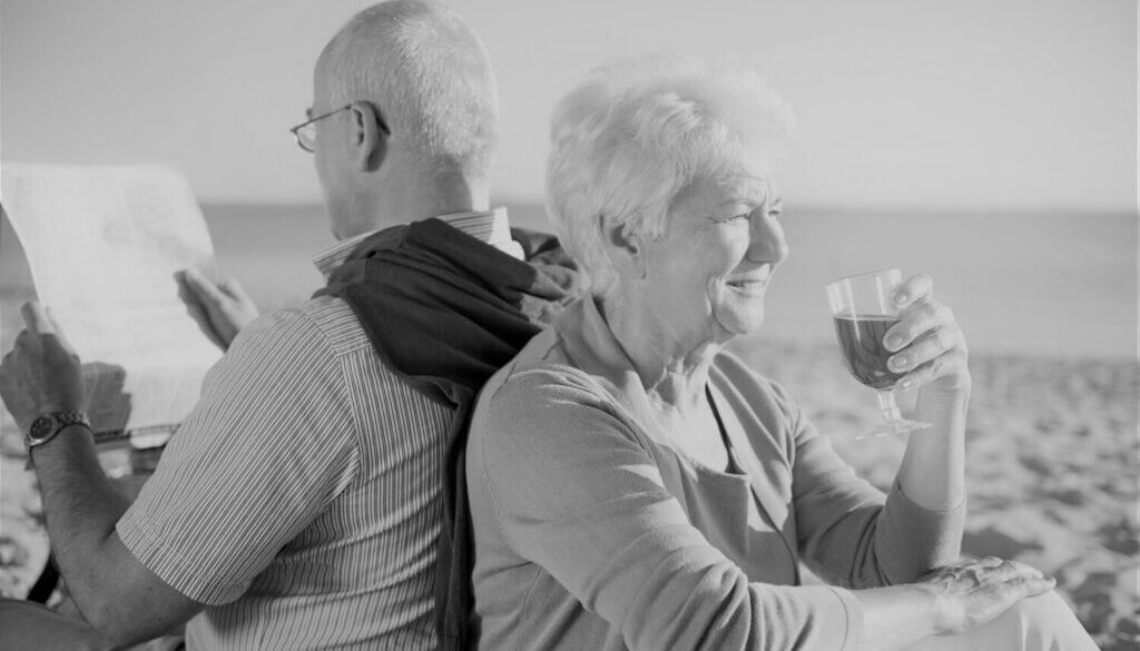 time-to-relax-on-the-beach-senior-couple-in-the-beach-retirement-and-summer-vacation-concept-scaled-1